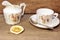 Retro porcelain tea cup and plate with silver spoon