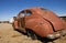 Retro Red Car in Junkyard