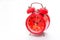 Retro red clock with bell show time at 10 am placing on white