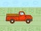 Retro red pickup truck in farm road