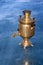 Retro samovar stands in the lake.