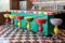 retro soda fountain counter with colorful stools