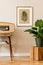 Retro space interior at home with gold mock up frame and vintage radio and potted plants.