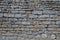 Retro square stones facade grey brown wall of grey stone horizontal background