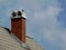 Retro style brick chimney with ornamental concrete cap stone