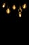 Retro style bulbs. Vintage glowing light bulbs on a black background