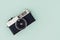 Retro style camera on color background. Top view, flat lay