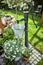 Retro style garden landscaping with old water pump