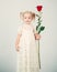 Retro style. happy birthday. wedding. small kid with red rose. happy childhood. love present. childrens day. little girl