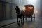 Retro style horse carriage on a foggy city street