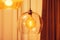 Retro style lamp inside electric spiral in warm light in double glass