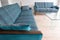 Retro style lounge sofas upholstered in blue / green striped wool fabric