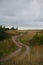 Retro style. Russian rural dirt road disappearing into the distance horizon