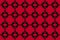 Retro style seamless fabric pattern with red square flower pattern with black background, for weaving industry and product pattern