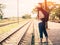 Retro style of traveler woman walking and waits train