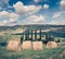 Retro style view of the wheat harvest in Tuscany. Sunny summer scene of Italian countryside, Val d`Orcia valley, San Quirico d`