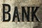 Retro styled image of an old stone bank sign