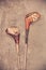 Retro styled image of two weathered ancient golf clubs