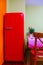 Retro-styled red refrigerator in the kitchen room