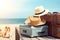 Retro suitcase and two straw hats are on the beach near sea water. Travel and vacation concept backdrop. Created with generative