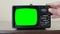 Retro television with green screen, switching channels