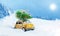 Retro toy car carrying christmas tree on roof in snowy winter forest. Christmas background. Holidays card. Copy space.