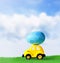 Retro toy car with Easter egg on the roof on spring background. Easter concept