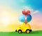 Retro toy car with Easter egg on the roof on spring background. Easter concept