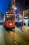 Retro tram on Istiklal street at night.