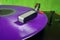 Retro turntable with purple vinyl record