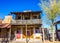 Retro Two Story Western Buildings With Hanging American Flags