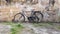 Retro vintage black bike on old brick wall