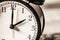 Retro vintage clock on sack closeup at 2 o`clock