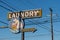 Retro vintage laundry sign and parking for a laundromat