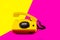 Retro vintage phone handset yellow pink red purple plastic orange disko background old style shadow 90 answer reply raised