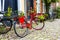 Retro vintage red bicycle on cobblestone street in the old town.