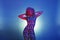 Retro woman from the eighties dancing and glowing on neon blue a
