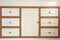 Retro wooden closet with drawers closeup, modern interior minimalist style wardrobe