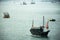 Retro wooden ship or Chinese junk boats in Victoria Harbour in Hong Kong, China