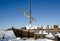 Retro wooden ship frozen lake ice sail people walk