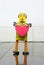 Retro yellow robot holding a red heart