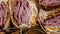 Reuben sandwich. Classic traditional American sandwich. Pastrami and corned beef on grilled bread