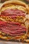 Reuben sandwich. Classic traditional American sandwich. Pastrami and corned beef on grilled bread