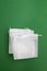 Reusable bags on green paper background