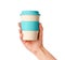 Reusable bamboo coffee cup with silicone holder in female hand. Isolated on white. Zero waste lifestyle