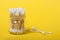 Reusable bamboo cotton buds on the yellow background