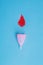 Reusable menstrual cup and blood drop symbol