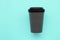 Reusable stylish eco friendly grey bamboo cup on mint background