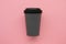 Reusable stylish eco friendly grey bamboo cup on pink background.