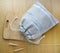 Reusable zero waste linen bread bag on wooden cutting board